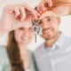 A couple holding keys to a new home